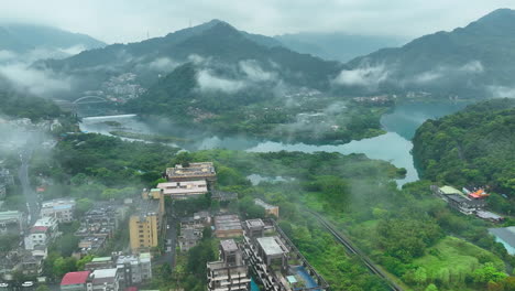 aerial flight in countryside of taiwan with fog in the morning with river and mountains