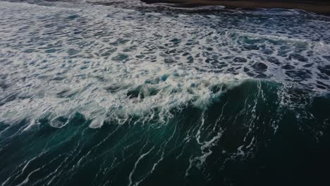 Aerial-View-to-blue-waves-in-the-sun-at-the-beach-in-Costa-Rica-at-the-Caribbean-between-Puerto-Viejo-and-Punta-Uva