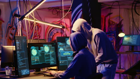 hackers in neon lit hideaway