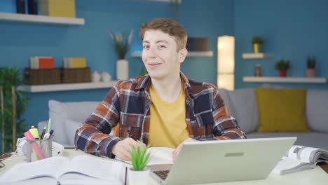 studying student winks at the camera with a smile.