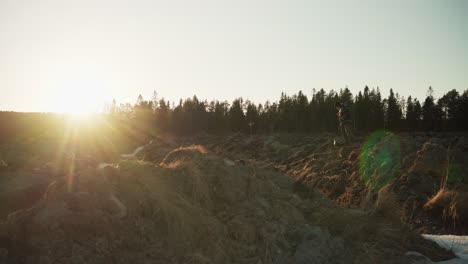 man with his dog walking in the field in the early morning