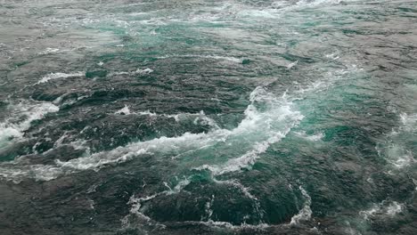 waves of water of the river and the sea meet each other during high tide and low tide.