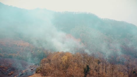 smog of forest fires. deforestation and climate crisis. toxic haze from rainforest fires, thailand, ma hon son. aerial video 4k