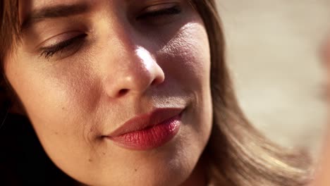 beautiful woman smiling on the beach - close up