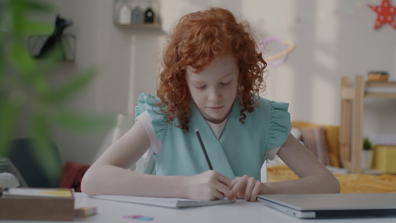 Child Doing Homework in Bedroom