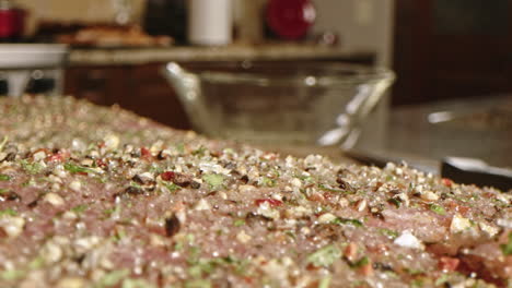 Macro-extreme-close-up-on-spices,-herbs,-and-seasoning-on-raw-BBQ-pork-ribs