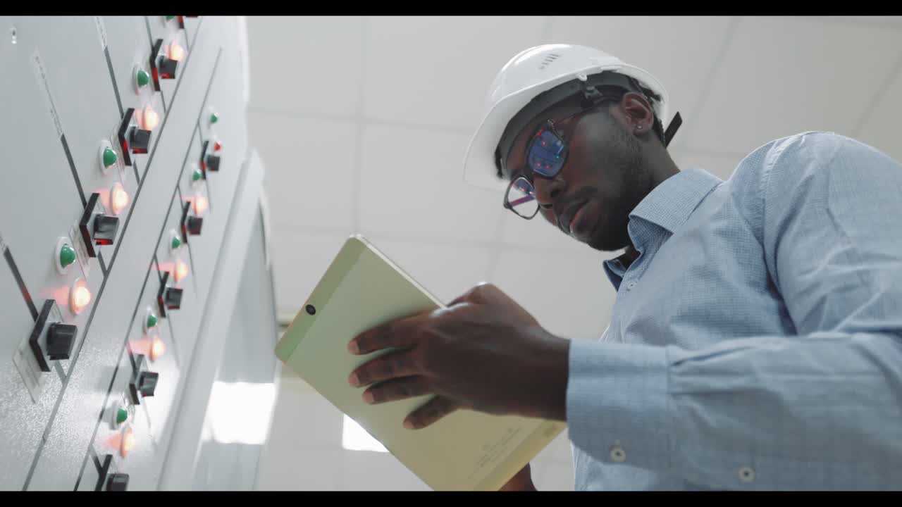 Engineer working on control panel