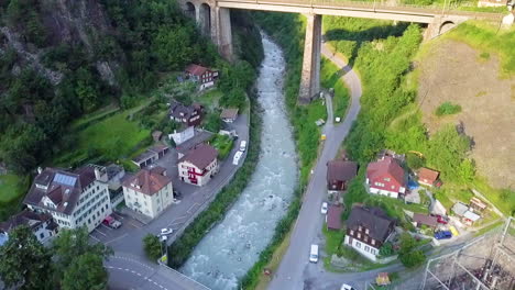 revealing shot of charstelenbach bridge crossing bristentobel gorge in silenen, switzerland