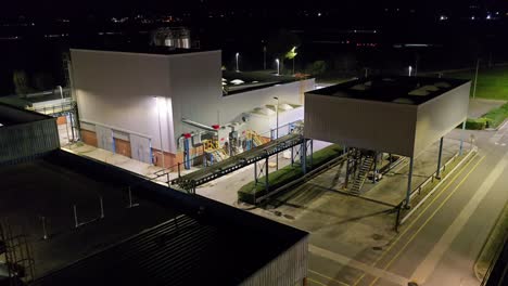 chemical factory, general plan partial view of the factory, you can see a forklift (bull) working on a dark and starry night.