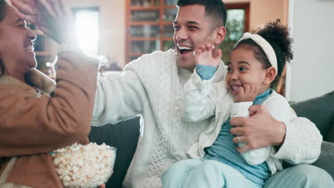 high five, celebrate and family with popcorn