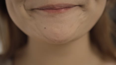 close-up of woman eating noodles