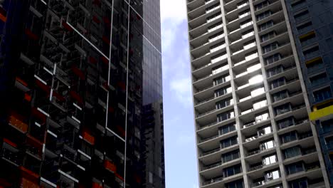 timelpase of clouds moving between city skyscrapers