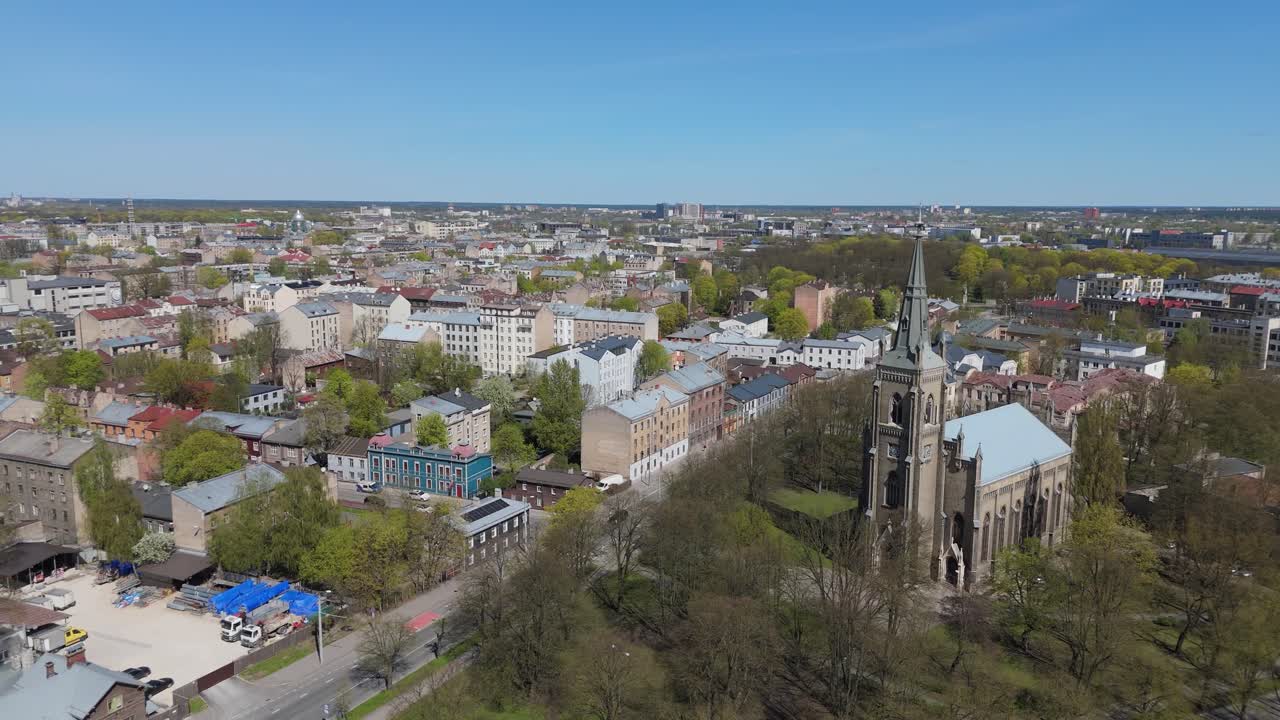 A Stunning Aerial Drone View Of Riga Panorama In Latvia On A Sunny Spring Day Showcasing The Rooftops Of Houses The Vibrant City Center And The Historic Buildings Riga St. Pauls Lutheran Church