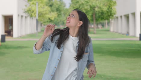 disturbed indian girl flying a bee