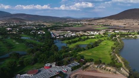 aerial view backwards over the hacienda cantalagua golf in sunny contepec, mexico