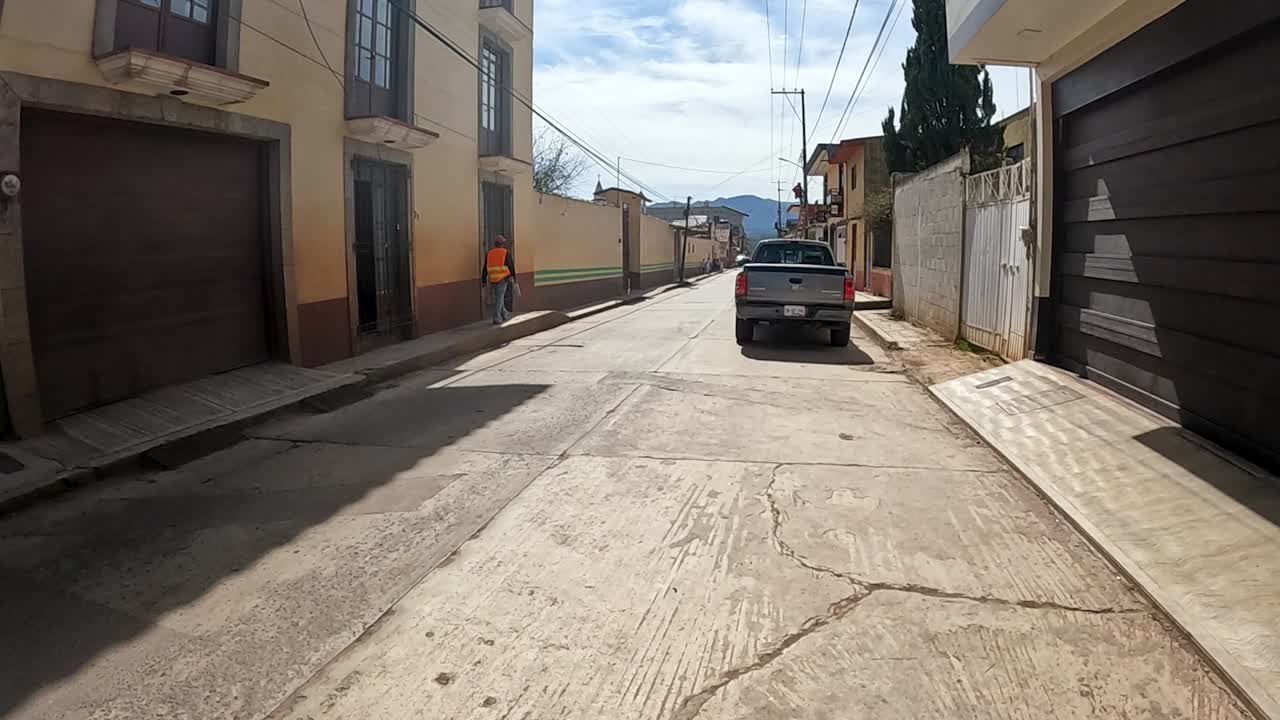 Walking Through a Charming Colonial Street with People in a Mexican Village