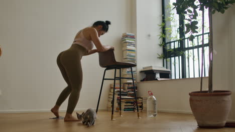 woman doing yoga pose in a home workout