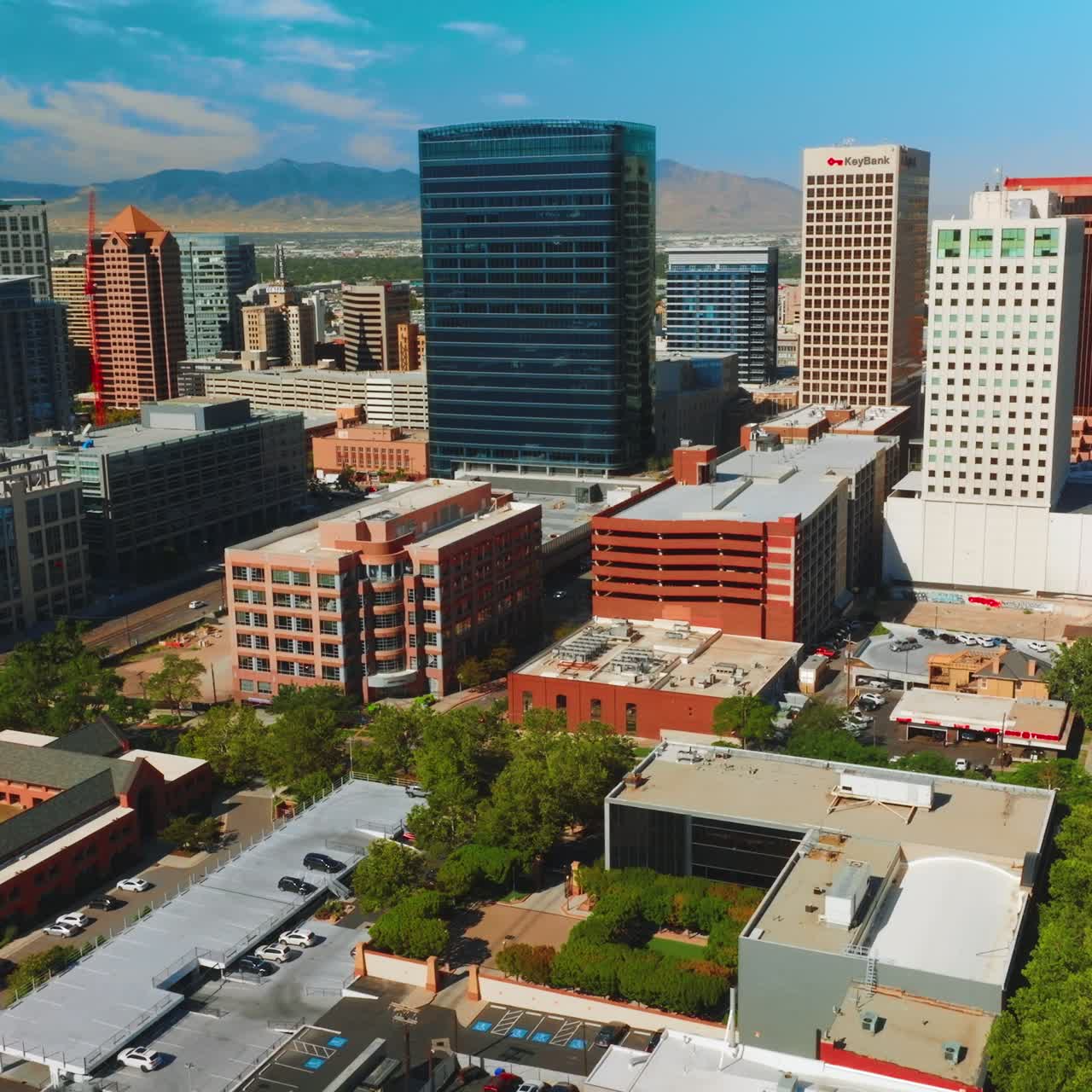 Bright architecture in financial downtown of sunny Salt Lake City in Utah. Beautiful American city at backdrop of mountains