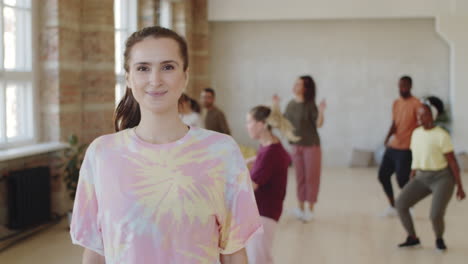 portrait of pretty young woman in dance class