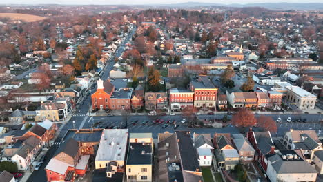 high aerial truck shot of small town america during golden hour