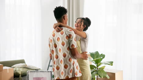 a couple embracing each other in their new home