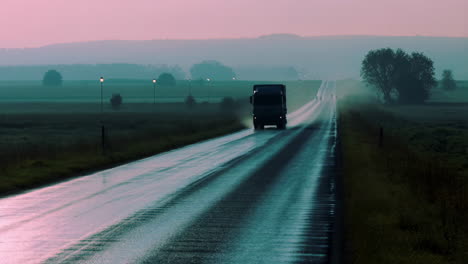 truck on a wet road at dawn or dusk