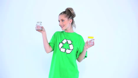 attractive environmental activist holding two bottles