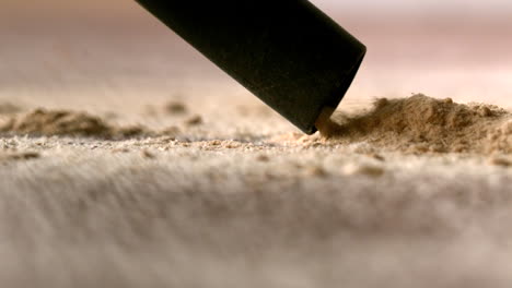 vacuum cleaner sucking up dust from carpet