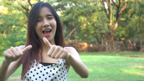 Slow-motion-portrait-of-joyful-Asian-woman.