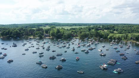 aerial, lake crowded with party motor boats during college spring summer break