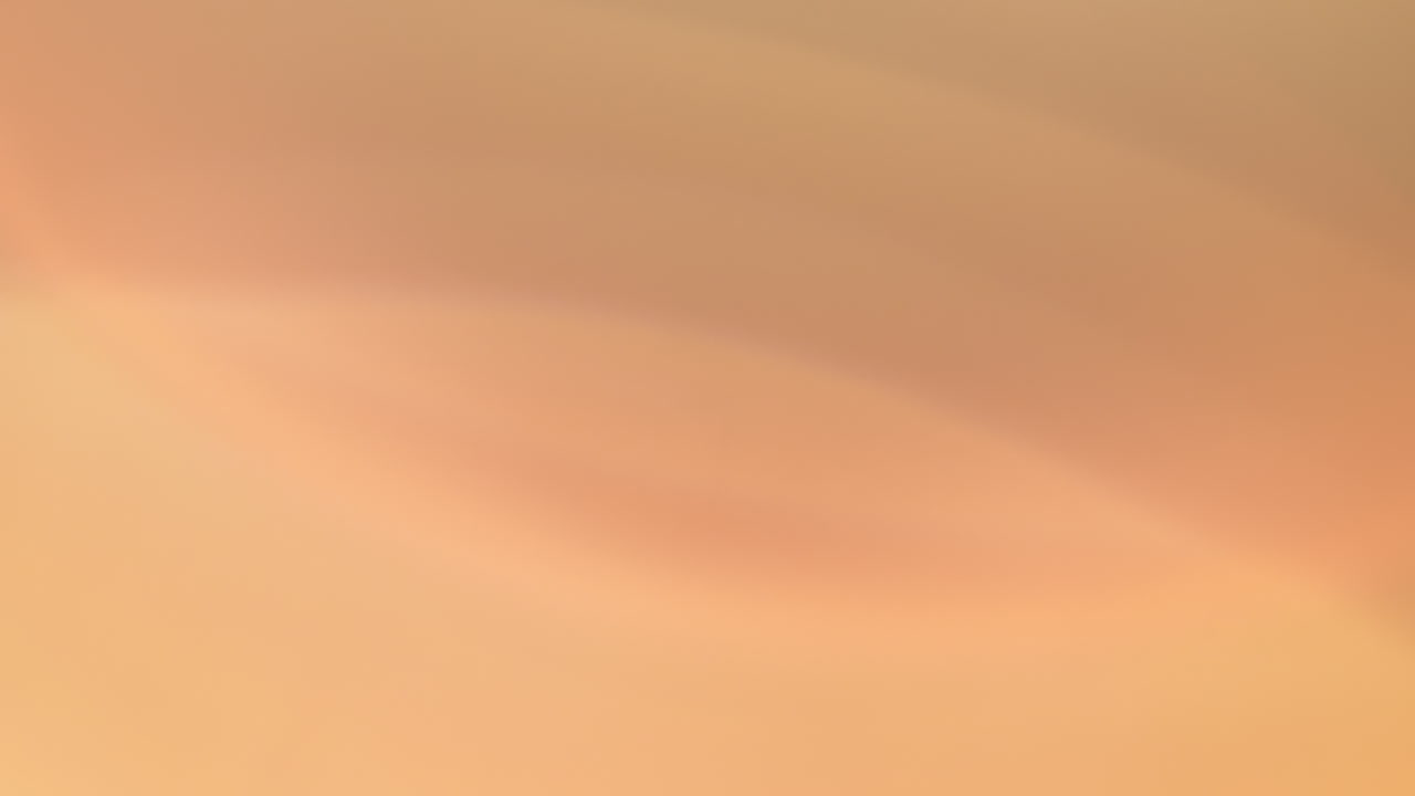 Warm abstract light effect from flashlight over black background