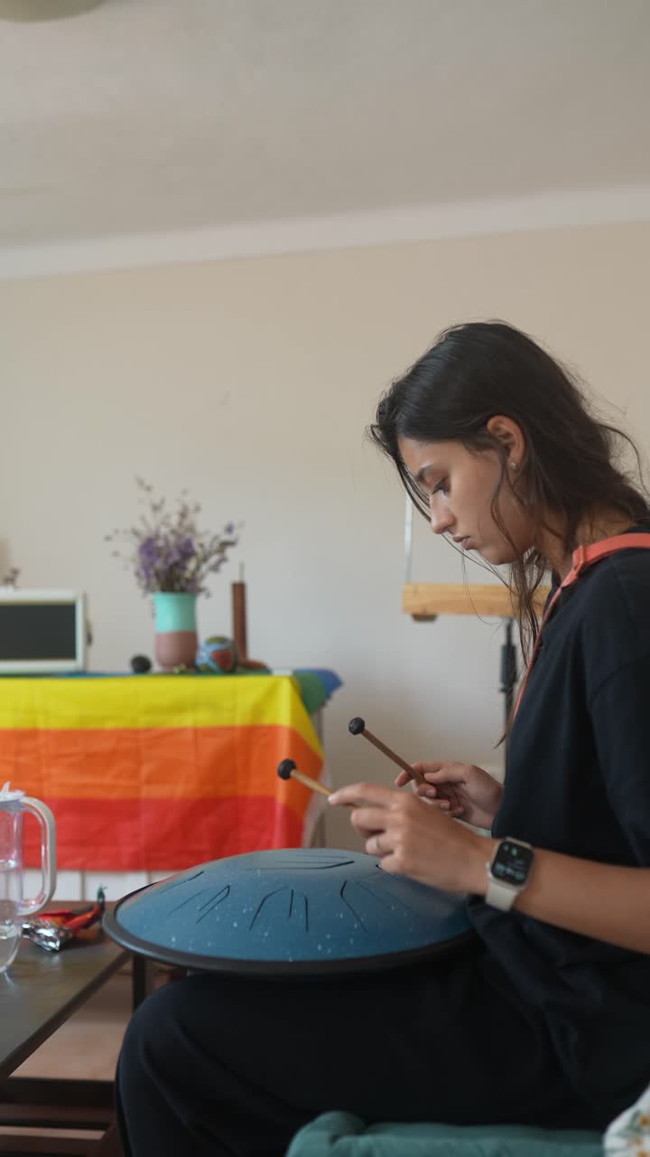 Woman Playing Singing Bowl