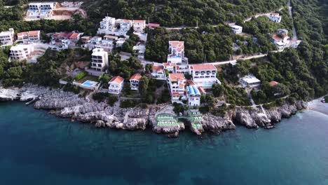 luxury seaside apartment buildings on shore of montenegro, aerial