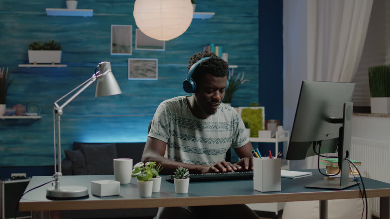 Entrepreneur with headphones listening to music and working