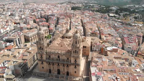 Spain-Jaen-Cathedral,-Catedral-de-Jaen,-flying-shoots-of-this-old-church-with-a-drone-at-4k-24fps-using-a-ND-filter-also-it-can-be-seen-the-old-town-of-Jaen