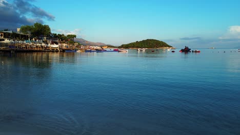 serene coastal view: boats docked at a picturesque island beach