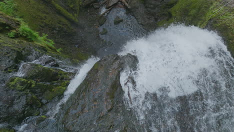 top down view of falls creek falls in gifford pinchot national forest tumbling over top of rocky cliff.