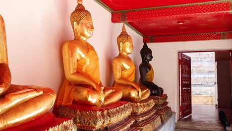 golden buddha statues in a serene temple setting