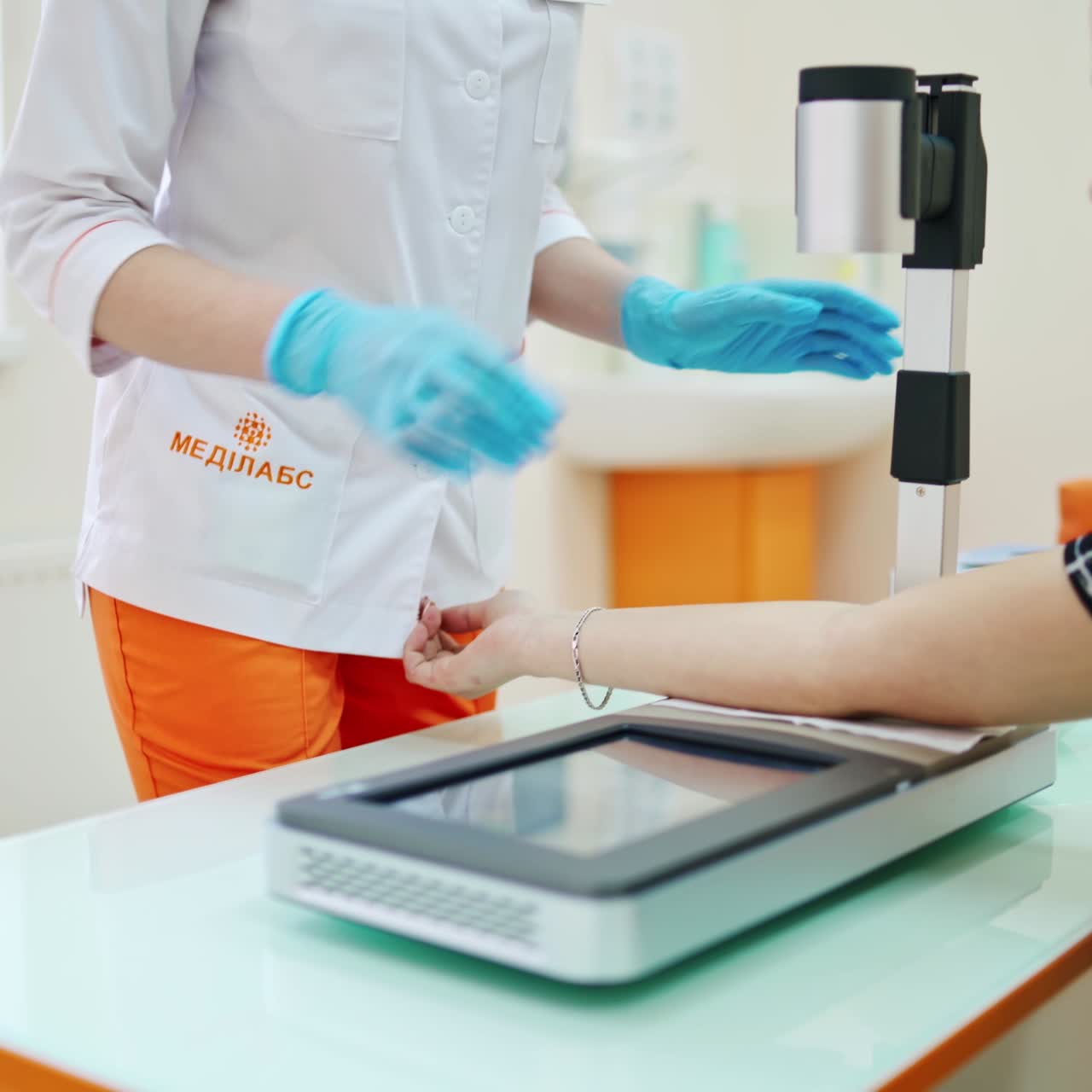 Nurse taking blood in clinic