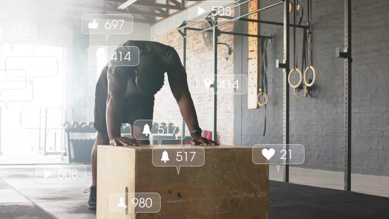 Gym athlete bracing on plyo box, adjusting hands, drawing animated likes around him, preparing jump