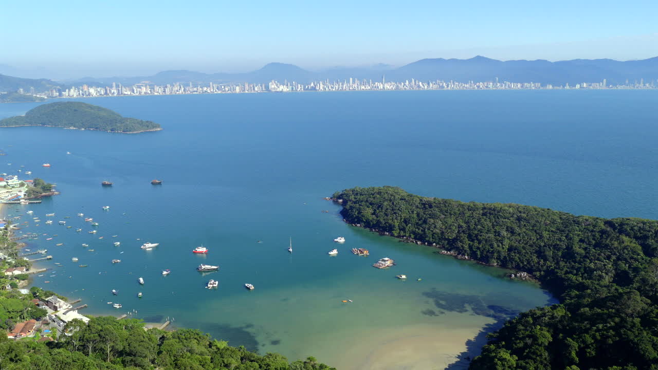 Aerial view of Beach with boats and vibrant shoreline scenery, Santa Catarina, Brazil