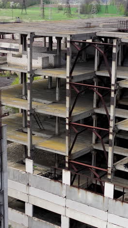 aerial view of ruined abandoned building. empty apocalipse city with damaged houses. vertical video