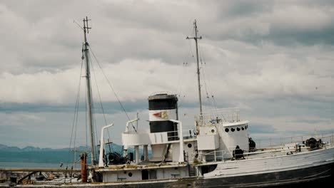 Dilapidated-Abandoned-Tugboat-In-Ushuaia-Harbor,-Tierra-Del-Fuego,-Argentina