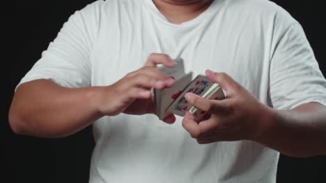 man showing his trick with usual cards, cardistry