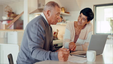 Talking,-senior-couple-and-insurance-with-laptop