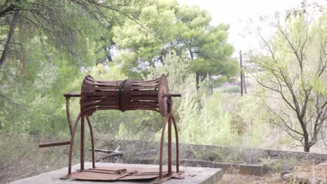 pan handheld footage of old rusty abandoned well, located at kifissia, athens, greece