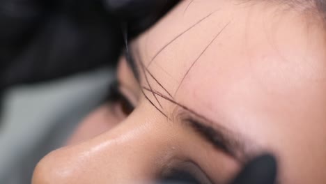 close-up of eyebrow mapping for microblading or permanent makeup procedure