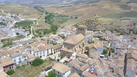 aerial tilt-down shot of the beautiful church of alhama de granada in andalusia