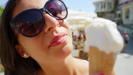 A-carefree-young-woman-enjoying-ice-cream