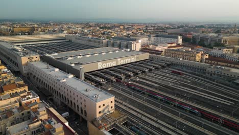 establishing drone view above roma termini train station in historic center of rome, italy